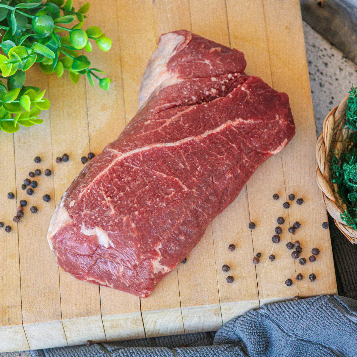 Grass-fed English roast ready for pot roast, on a cutting board – Waseda Farms